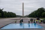 Crews spray a new blue coating on the Lincoln Memorial Reflecting Pool.