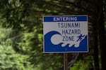 A sign warning drivers that they are entering a tsunami hazard zone is displayed along U.S. Route 101 also known as the Oregon Coast Highway north of Lincoln City, Ore., on June 14, 2024.