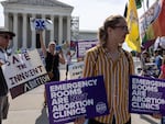 Anti-abortion demonstrators gather in front of the Supreme Court on Wednesday, the day a copy of the Idaho ruling was accidentally posted to the court's website. 