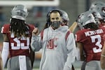 FILE - Then Washington State head coach Nick Rolovich looks on during the second half of an NCAA college football game against Utah State, Saturday, Sept. 4, 2021, in Pullman, Wash.