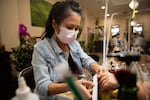 Suong Huynh removes a set of gel nails for a client at her salon in Bend, Ore., on Nov. 18, 2024.