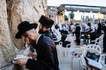 Orthodox Jews pray at the Western Wall in Jerusalem's Old City on March 25.