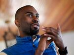 n this March 26, 2016, file photo, Black Lives Matter activist DeRay Mckesson chats with campaign volunteers in Baltimore.  