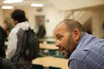 Ken Ramirez talks to students in the cafeteria at McKay High School in Salem, Ore., Tuesday, Sept. 17, 2019. Community resource specialists like Ramirez help student groups achieve academic success with one-on-one support.