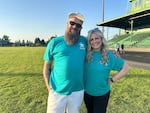 "One More Time Around Again Marching Band" members Chris Conti, left, and Allison Ziarnik, right, after a performance at Parkrose High School. Conti and Ziarnik both went to high school at Parkrose and were music students of OMTAAMB director Tawnya Garcia.