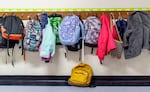 Backpacks line the hallway at Prescott Elementary in Northeast Portland, Feb. 8, 2022.