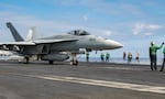 Capt. Bradley D. Converse sits in his Boeing EA-18G Growler electronic warfare aircraft on the deck of the USS Harry S. Truman carrier cruising in the Mediterranean Sea, Thursday, March 17, 2022. The USS Truman aircraft carrier is operating a joint exercise in the central Mediterranean Sea with French and Italian carriers directly supporting NATO enhanced air policing missions and patrolling the Romanian border with Ukraine. (AP Photo/Giuseppe Distefano)