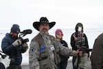 Pete Santilli, an Internet radio host and strong advocate of the armed occupation near Burns, Oregon, led a demonstration outside the FBI's makeshift headquarters there.