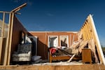 A person walks through a house in the community of Sunshine Hills outside of London, Kentucky. A tornado struck the neighborhood of Sunshine Hills just after midnight on May 17, 2025 in London, Kentucky. (Photo by Michael Swensen/Getty Images)