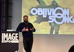 Robert Kirkman describes his newest comic, "Oblivion Song" — about an alternate dimension full of monsters that trades places with Philadelphia — at the Image Expo in Portland.
