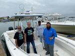 Volunteer turtle rescuers hauled in so many cold-stunned turtles they could barely walk on the boat's deck.