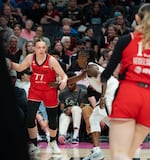FILE - Portland Fire guard Holly Winterburn (77) dribbles the ball towards the basket at the Moda Center in Portland, Ore., on July 9, 2026.
