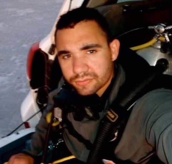 Navy Diver Matt Kelly in Salalah, Oman circa 2010 before doing an underwater sweep of a pier to look for improvised explosive devices.<br>