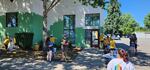 Volunteers paint a building in downtown Sweet Home, Oregon.