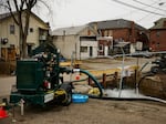 Water is pumped into a creek for aeration on Feb. 14 in East Palestine, Ohio.