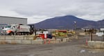 Trucks haul aggregates out of the Woodward pit on April 12, 2023.