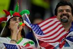 Supporters cheer prior to the World Cup group B soccer match between Iran and the United States at the Al Thumama Stadium in Doha, Qatar.