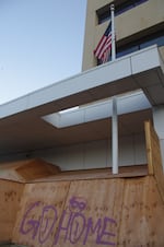 Protective plywood covers the doors and windows of the U.S. Immigration and Customs Enforcement facility in Portland, Ore.