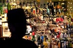 Bottles of alcohol sit on shelves at a bar in Houston on June 23, 2020.