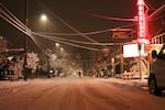 A bicyclist heads north on Milwaukie Avenue in Portland's Sellwood neighborhood during a snow storm on Wednesday, Jan. 11, 2017.