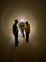 In this handout photo from January 2022, workers inside a giant pipe used to modernize a main canal in the Central Oregon Irrigation District.