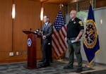 In this contributed photo, FBI Portland Special Agent in Charge Douglas Olson, left, and Columbia County Sheriff Brian Pixley, right, speak at a press conference at the FBI office in Portland, Ore., June. 5, 2025.