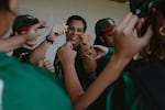 Sabrina Robinson (center) fist bumps her Boston Hunters teammates at the conclusion of a preseaon scrimmage prior to Opening Weekend of the Women's Pro Baseball League. Springfield, IL, July 30, 2026.