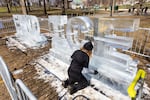 Kat Carves works on a ice sculpture that says ‘End Ice’ ahead of the No King rally in the Boston Common on Saturday, March 28, 2026.