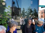 Heidi Endris, center, awaits the demolition.