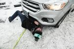 Christian Bartlettt, a construction worker, estimates he's pulled 10 people out of the snow. "It makes everyone lives a lot easier to pull over and help them out, versus driving by."