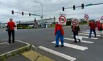 Wyoming Gov. Matt Mead's visit to the Millennium coal export terminal drew protesters in red shirts outside the facility. Supporters of the project demonstrated across the street wearing blue shirts.