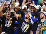 Stephen Curry raises the NBA Finals Most Valuable Player Award after the Golden State Warriors defeated the Boston Celtics 103-90 in Game 6 of the 2022 NBA Finals on June 16, 2022 in Boston.