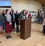 Wildfang CEO Emma Mcilroy, center, explains how tariffs are especially hurting apparel companies. She was part of a roundtable with Gov. Tina Kotek, right, and State Treasurer Elizabeth Steiner on April, 16, 2025, in Salem, Ore.