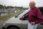 Joe Hodge, 93, often drives down to the harbor in Brookings to watch the world go by. He used to enjoy watching the cats here, but the colony was removed recently.