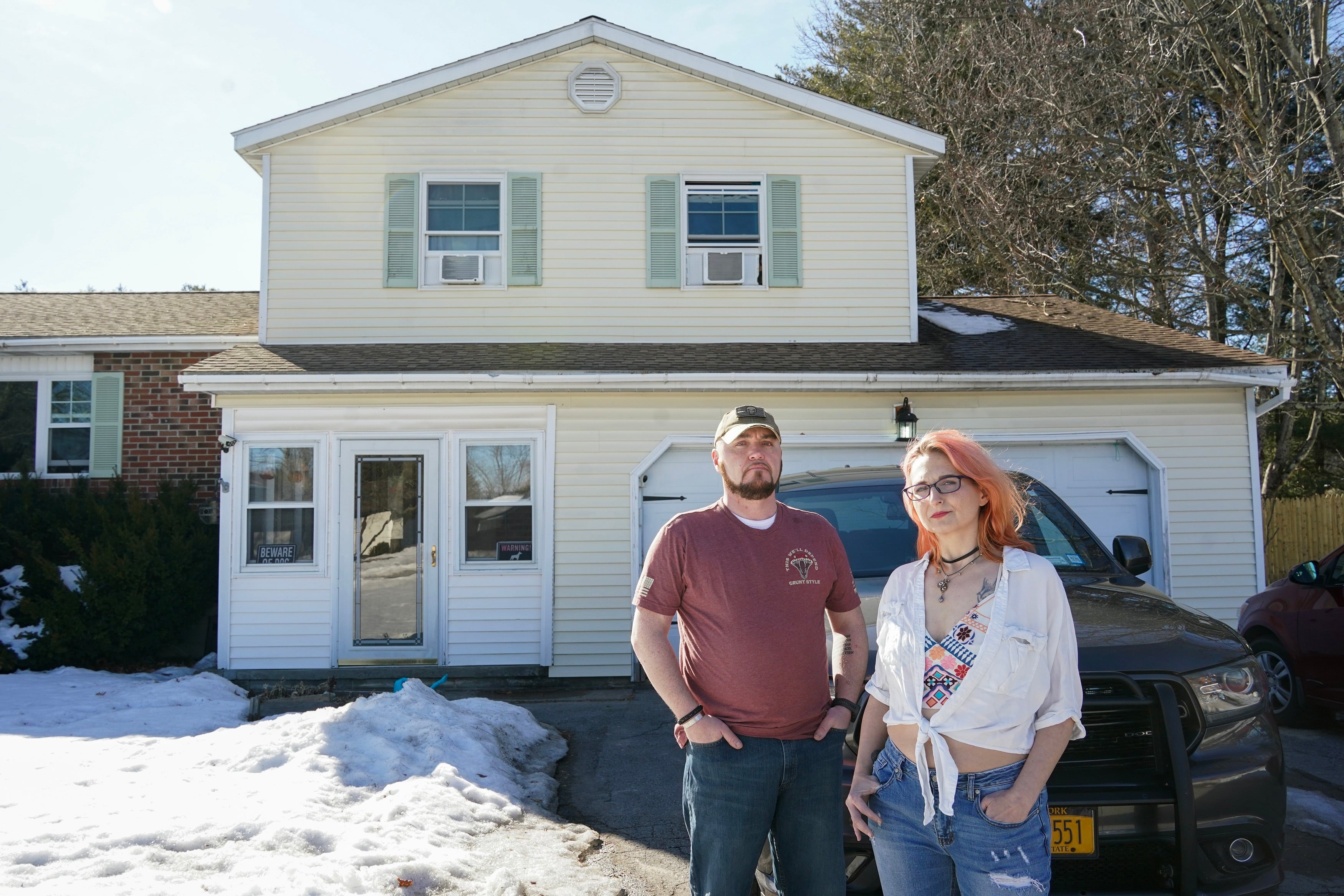 Kevin Conlon and his wife, Jenny, at their home in upstate New York. The couple have owned the house for 12 years and don't know where they would go if they lose it.