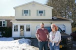 Kevin and Jenny Conlon in front of their home.
