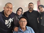 Hani Almadhoun takes a selfie with his siblings, Samah, Mohamed and Faten, and their father, Omar, in Gaza in July 2023 when he last visited.