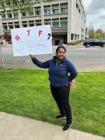 Gresham childcare provider Anita Bates holds a sign at a Wednesday rally advocating support for childcare providers.