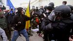 Supporters of Donald Trump try to break through a police barrier Jan. 6 at the U.S. Capitol. The House of Representatives is set to take up legislation Wednesday to create a select committee to investigate the insurrection.