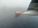 A photo provided by the U.S. Coast Guard on Wednesday shows a ship searching for the lost submersible near the wreck site of the Titanic.