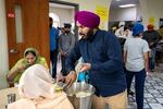 Perry helps serve a meal at the Sikh Temple of Wisconsin on Sunday, Sept. 22, 2024, in Oak Creek, Wis.