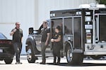 FBI agents stage at GKN Aerospace in Garden Grove, Calif., on Wednesday.