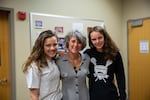 Sisters High School students Sydney and Skylar Wilkins stand with health teacher Heather Johnson (center). "Our students are more stressed than they’ve ever been,” Johnson says.