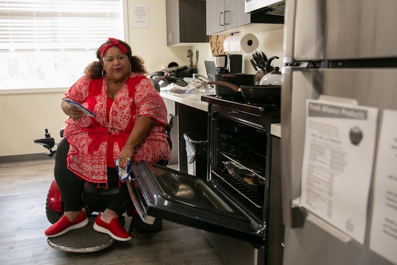 Angelita Amaya cooks chile verde at the homeless shelter where she resides in Monmouth.