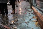 Along the many businesses in the area, debris from the blast can still be found on the ground.