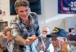 Republican congressional candidate Joe Kent waves to a supporter at Clark County Republican Party headquarters on July 31, 2024. Kent is likely to face a rematch with Democrat U.S. Marie Gluesenkamp Perez for Washington's 3rd Congressional District seat.