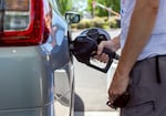 Jason Stafford pumps gas into a car at Bend, Ore., gas station, July 5, 2024. Money from Oregon's gas tax supports the State Highway Fund, used by the Oregon Department of Transportation's for road maintenance projects.