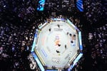 Alex Pereira, far right, is attended to, as Ciryl Gane lays in the center of the ring during UFC Freedom 250 on the South Lawn of the White House, Monday, June 15, 2026, in Washington.