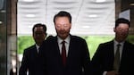 Former South Korean President Yoon Suk Yeol, centerm arrives at a court to attend a hearing to review his arrest warrant requested by special prosecutors in Seoul, South Korea Wednesday, July 9, 2025.