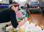 Jessi Just of Nehalem, Ore., puts the finishing touches on a parfait dessert made with vanilla pudding, strawberry pie filling and crushed hazelnuts.